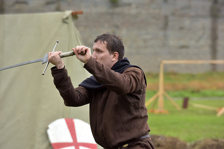 Russia, Ivangorod 01.08,2015 Festival of medieval reconstruction Russian fortress, Fencing on swords...