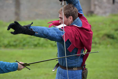 Russia, Ivangorod 01.08,2015 Festival of medieval reconstruction "Russian fortress", Fencing on swords in medieval costumesのeditorial素材