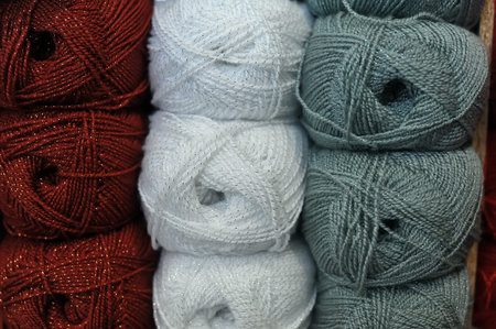 coils of wool: white, red and gray background