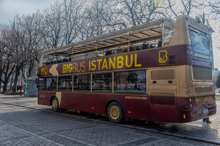 Turkey, Istanbul, 11,03,2018    Sight seeing tourist bus BigBus passing through Galata Bridge,...