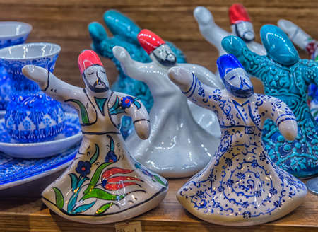Turkey, Istanbul, 20,03,2018  Close-up of ceramic statuettes of whirling dervishes  at a Turkish marketのeditorial素材