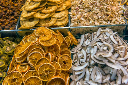 dried orange, coconut and other fruits on the marketの写真素材