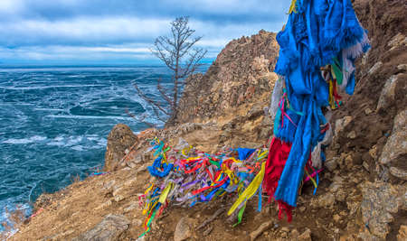 Buddhism symbol - ritual shaman pillars on Olkhon island, Russiaの写真素材