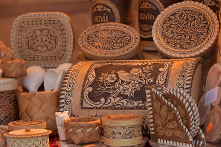 Handicrafts made of birch bark . Mugs with a lid made of birch bark in the shopの写真素材