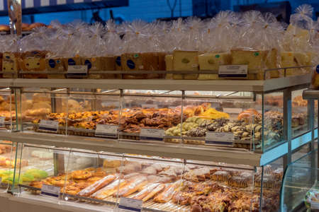 Thailand, Bangkok 24,08,2018 A variety of pastries on the shelves of a bakery in a shopping centerのeditorial素材