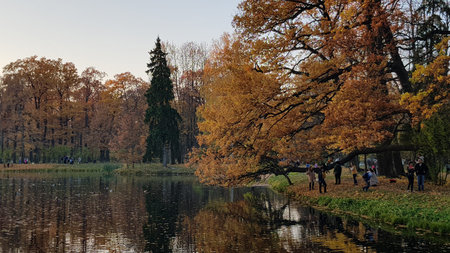 Russia, Pushkin, 14,10,2018 Autumn Park with an island and canals and people walking