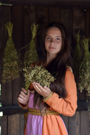 Portrait of a young beautiful dark-haired woman in ethnic dressの写真素材