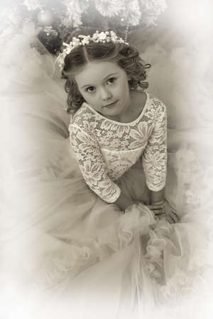 vintage portrait of a little girl in christmasの写真素材