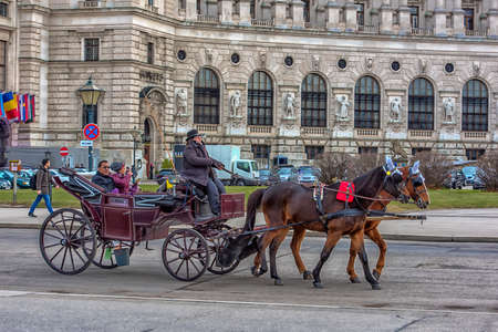 Austria, Vienna 30,12,2017 Traditional travel on a trip with horse carriage ride in the center of Viennaのeditorial素材