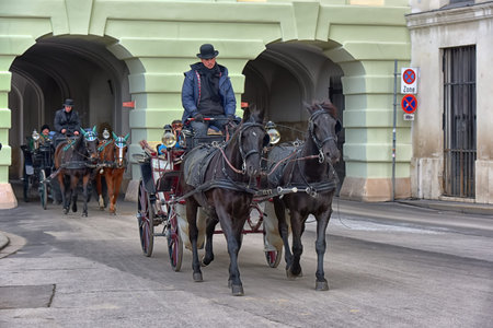 Austria, Vienna 30,12,2017 Traditional travel on a trip with horse carriage ride in the center of...