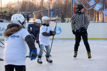 Russia, Severodvinsk 27,11,2016 Children with hockey sticks playing hockey at the festival "Hockey Day" outdoor street festivalのeditorial素材