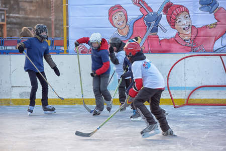 Russia, Severodvinsk 27,11,2016 Children with hockey sticks playing hockey at the festival "Hockey Day" outdoor street festivalのeditorial素材