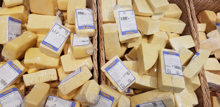 Russia, St. Petersburg 16,12,2018 Sliced and packed into polyethylene pieces of cheese