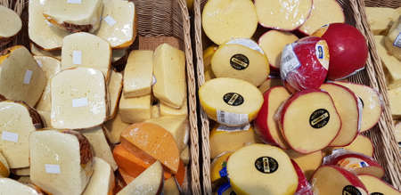 Russia, St. Petersburg 16,12,2018 Sliced and packed into polyethylene pieces of cheeseのeditorial素材