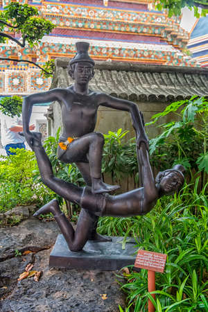 Statues of hermit at showing a posture of massage therapy at Temple of Reclining Buddha or Wat Pho, Bangkok, Thailand.の写真素材
