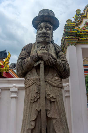 Close up the ancient Chinese warrior stone statues at wat Pho the temple in Bangkok,Thailand.の写真素材