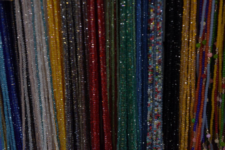 beads of different colors hanging background