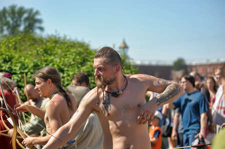 Russia, St. Petersburg 24,05,2014 People in medieval clothes shoot from a bow at the festival of historical reconstruction "Norwegian Vikings"のeditorial素材