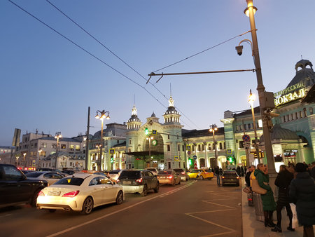 Russia, Moscow 03,04,2019 Belorussky Station in the evening and the traffic of cars in front of himのeditorial素材