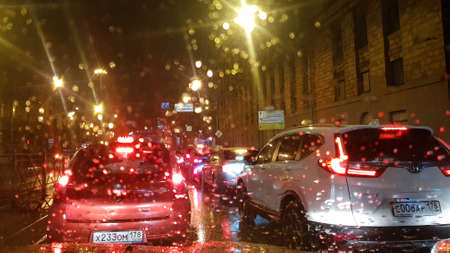 Russia, St. Petersburg 17,11,2019 A car on the road through raindrops on the windshieldのeditorial素材