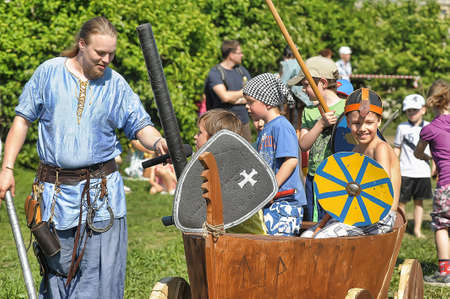 Russia, St. Petersburg 24,05,2014 Children play with shields at the Norwegian Vikings festival of medieval cultureのeditorial素材