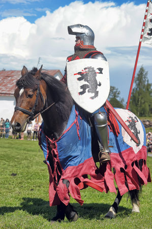 Russia, Priozersk 06.07.2014 A knight with a spear on a horse at the Russian Fortress festival of historical reconstructionのeditorial素材
