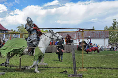 Russia, Priozersk 06.07,2014 Two knights fight on spears at the festival of historical reconstruction "Russian Fortress"のeditorial素材