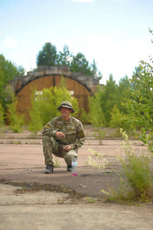 St. Petersburg, RUSSIA 20.06.2014 Open-air paintball tournament at the end of summer in nature, People in camouflage, with paintball guns and masksのeditorial素材