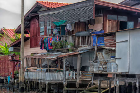 Thailand, Bangkok, 06.07.2019 Riverside slums & Fishermen Life in Chao Phraya Riverのeditorial素材