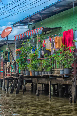 Thailand, Bangkok, 06.07.2019 Riverside slums & Fishermen Life in Chao Phraya Riverのeditorial素材