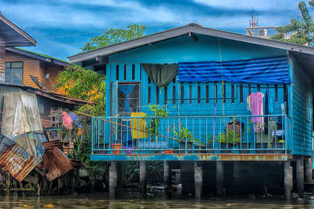 Thailand, Bangkok, 06.07.2019 Riverside slums & Fishermen Life in Chao Phraya Riverのeditorial素材