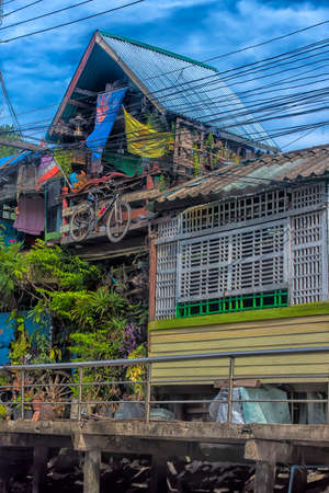 Thailand, Bangkok, 06.07.2019 Riverside slums & Fishermen Life in Chao Phraya Riverのeditorial素材