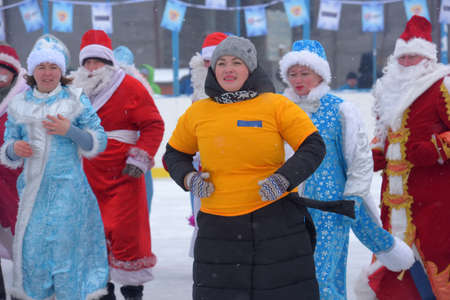 Russia, Chuvashia 14,01,2020 Many Santa Clauses and Snow Maidens dance together, a flash mobのeditorial素材