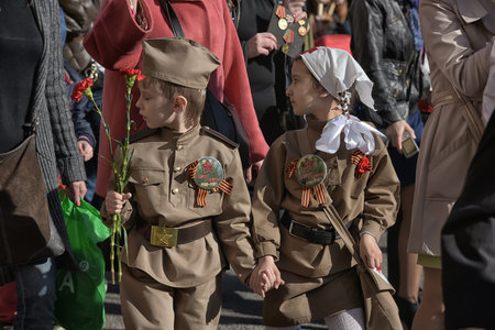 Russia, St. Petersburg 05/09/2015 Children in military clothing from the Second World War on Nevsky...