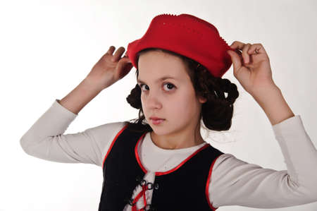 child girl in bavarian clothes and red hatの写真素材