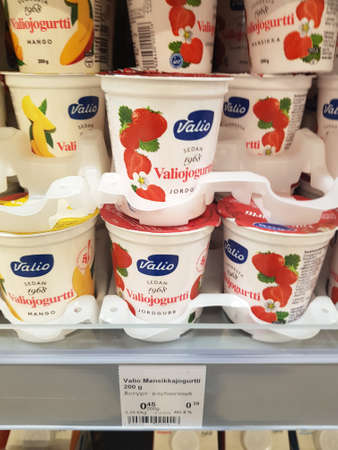 Finland, Lappeenranta 11.05,2019 Valio yoghurts on supermarket shelvesのeditorial素材