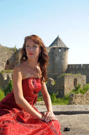 woman in a red dress on a backgroundの写真素材