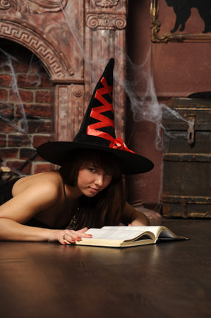 Young witch in a hat