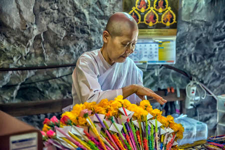 Thailand, Phetchaburi 09.07.2019 Wat Tham Khao Yoi is a beautiful temple adjacent to the rocky mountains of Phetchaburi Province in Thailand.のeditorial素材