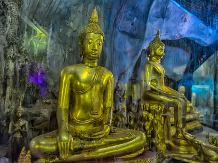 Thailand, Phetchaburi 09.07.2019 Wat Tham Khao Yoi is a beautiful temple adjacent to the rocky mountains of Phetchaburi Province in Thailand.のeditorial素材