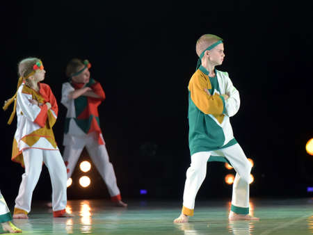 Russia, St. Petersburg 16.06.2019 Performance of a children's dance group in Russian costumes, modern dance at the open festival of creativity "White Nights"のeditorial素材