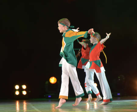 Russia, St. Petersburg 16.06.2019 Performance of a children's dance group in Russian costumes, modern dance at the open festival of creativity "White Nights"のeditorial素材