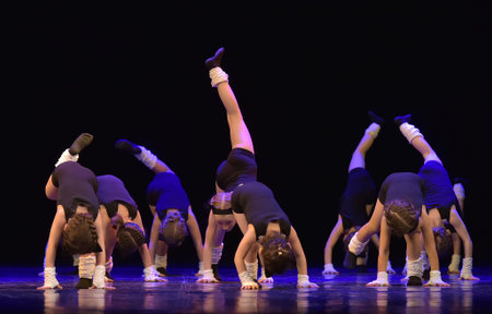 Russia, St. Petersburg 20,05,2019 Young children in black pants and t-shirts dance on stage