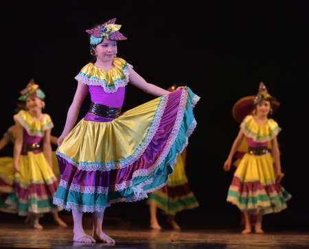 Russia, St. Petersburg 20,05,2019 Children in colorful costumes dance Mexican dance on stageのeditorial素材