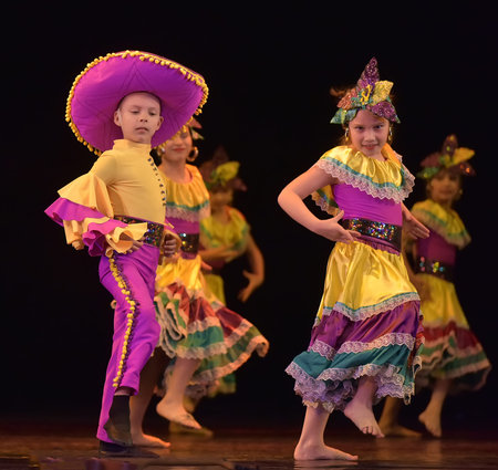 Russia, St. Petersburg 20,05,2019 Children in colorful costumes dance Mexican dance on stageのeditorial素材