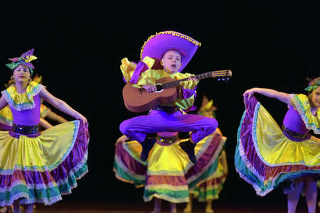 Russia, St. Petersburg 20,05,2019 Children in colorful costumes dance Mexican dance on stageのeditorial素材