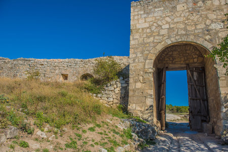 the remains of a medieval fortress city (according to other sources - a monastery) Tepe-Kermen, covering the upper part of the mountain in several tiersの写真素材