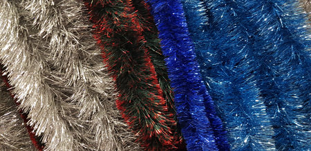 bright multicolored christmas serpentine garlands for christmas tree background
