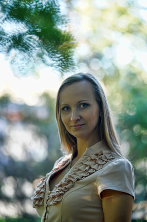 portrait of 30 year old blonde woman in parkの写真素材