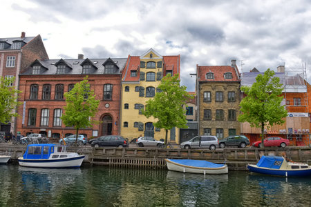 Copenhagen, Denmark - 07,05,2016: View of Nyhavn pier with color buildings, ships, yachts and other...